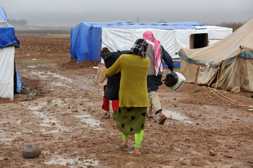 In the Bekaa Valley, heavy rain and snow turn Syrian refugees' settlements into muddy swamps - December 2013 © Sebastien Chatelier